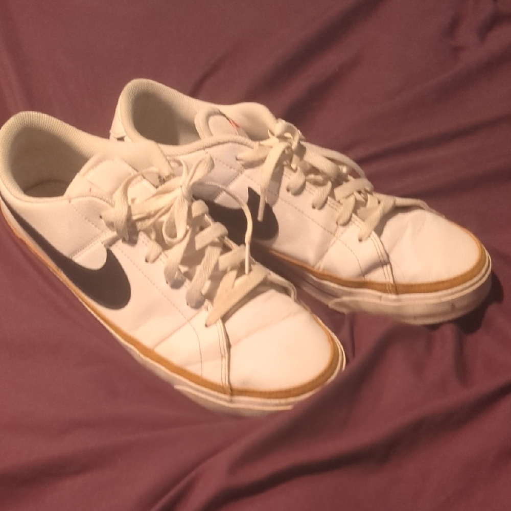 Nike White Low-Top Sneakers with Black Swoosh and Gum Trim